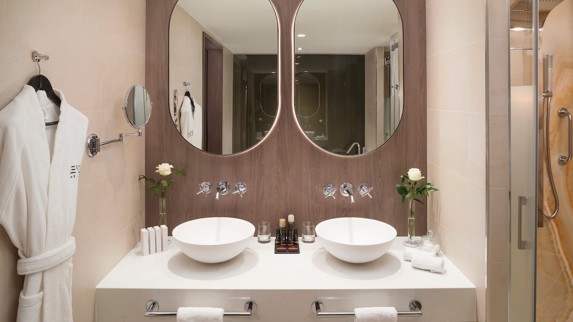 a bathroom with two sinks and mirrors