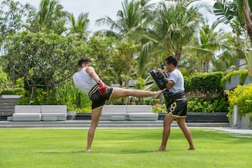 two men kicking a kick