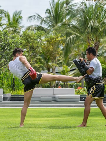 two men kicking a kick