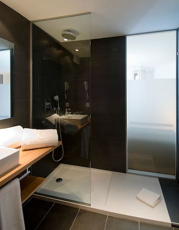 a bathroom with a shower and sink