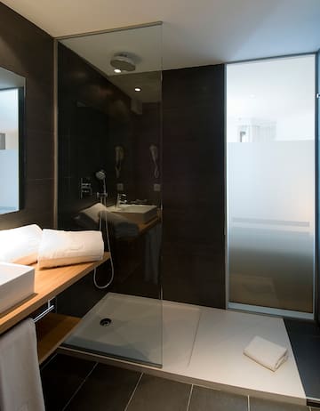 a bathroom with a shower and sink