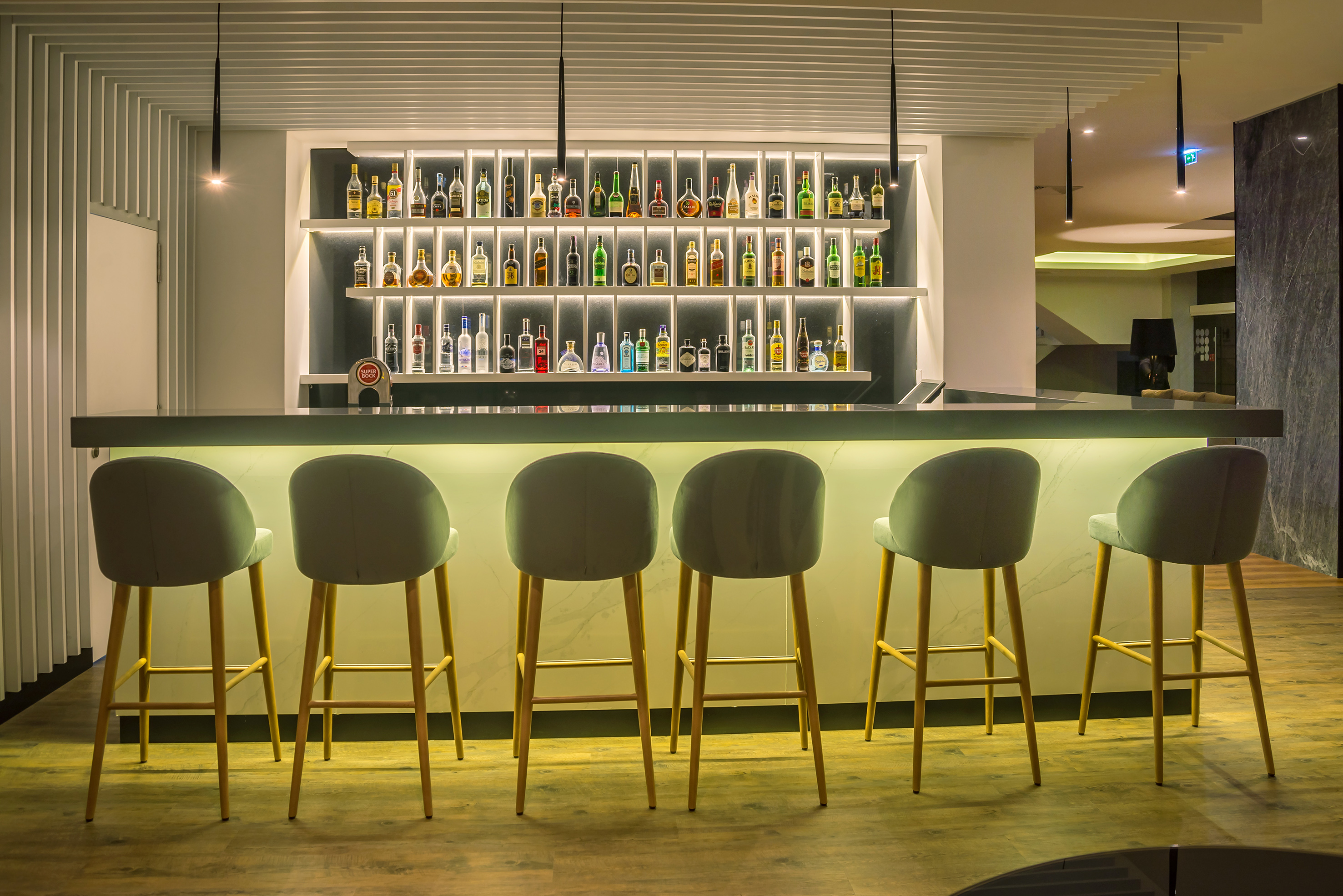 a bar with many bottles of liquor