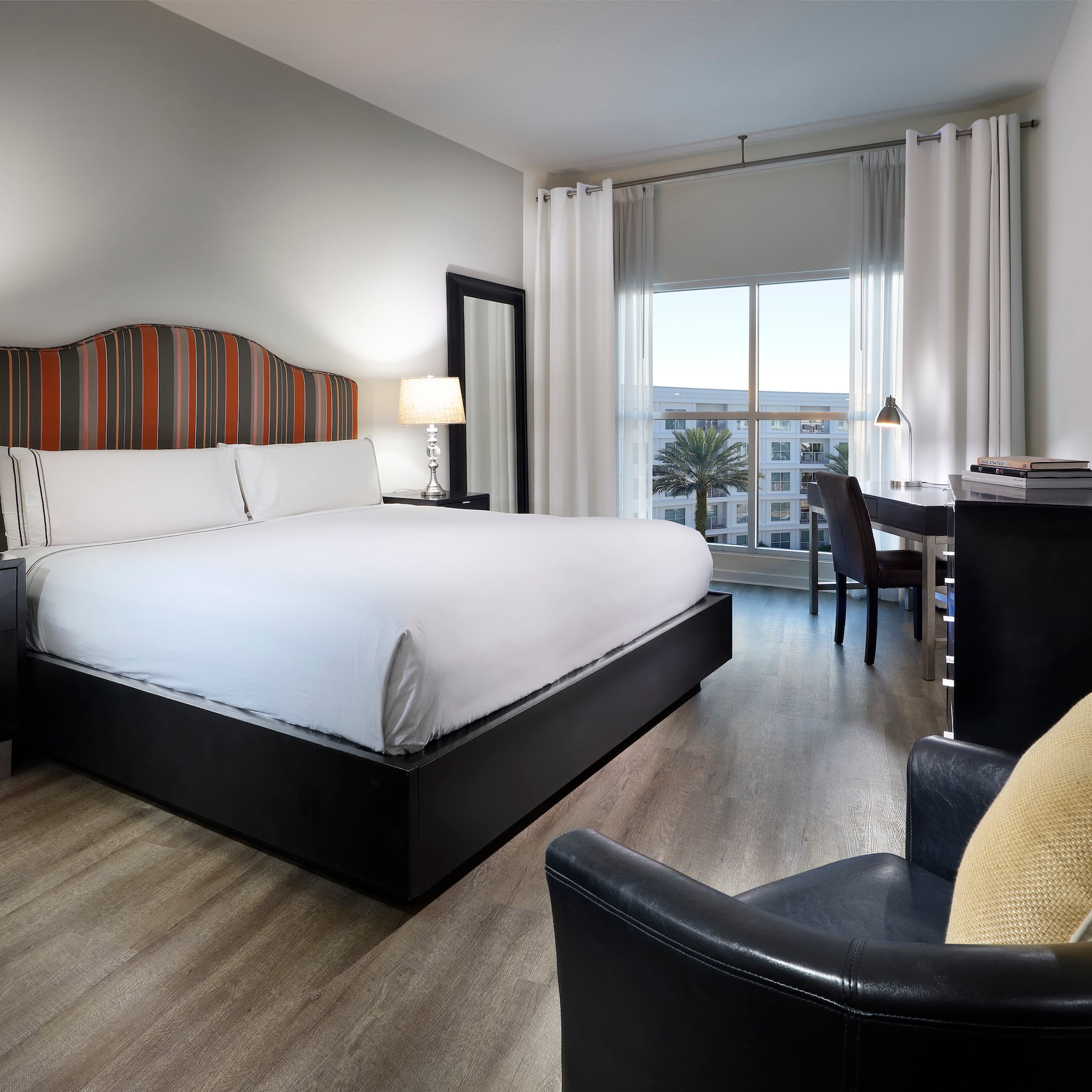 a room with a bed and a desk