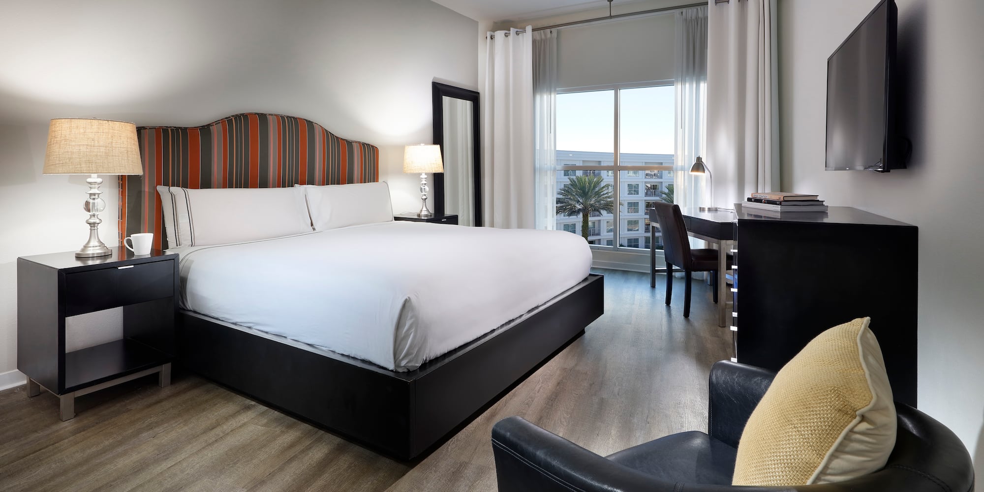 a room with a bed and a desk