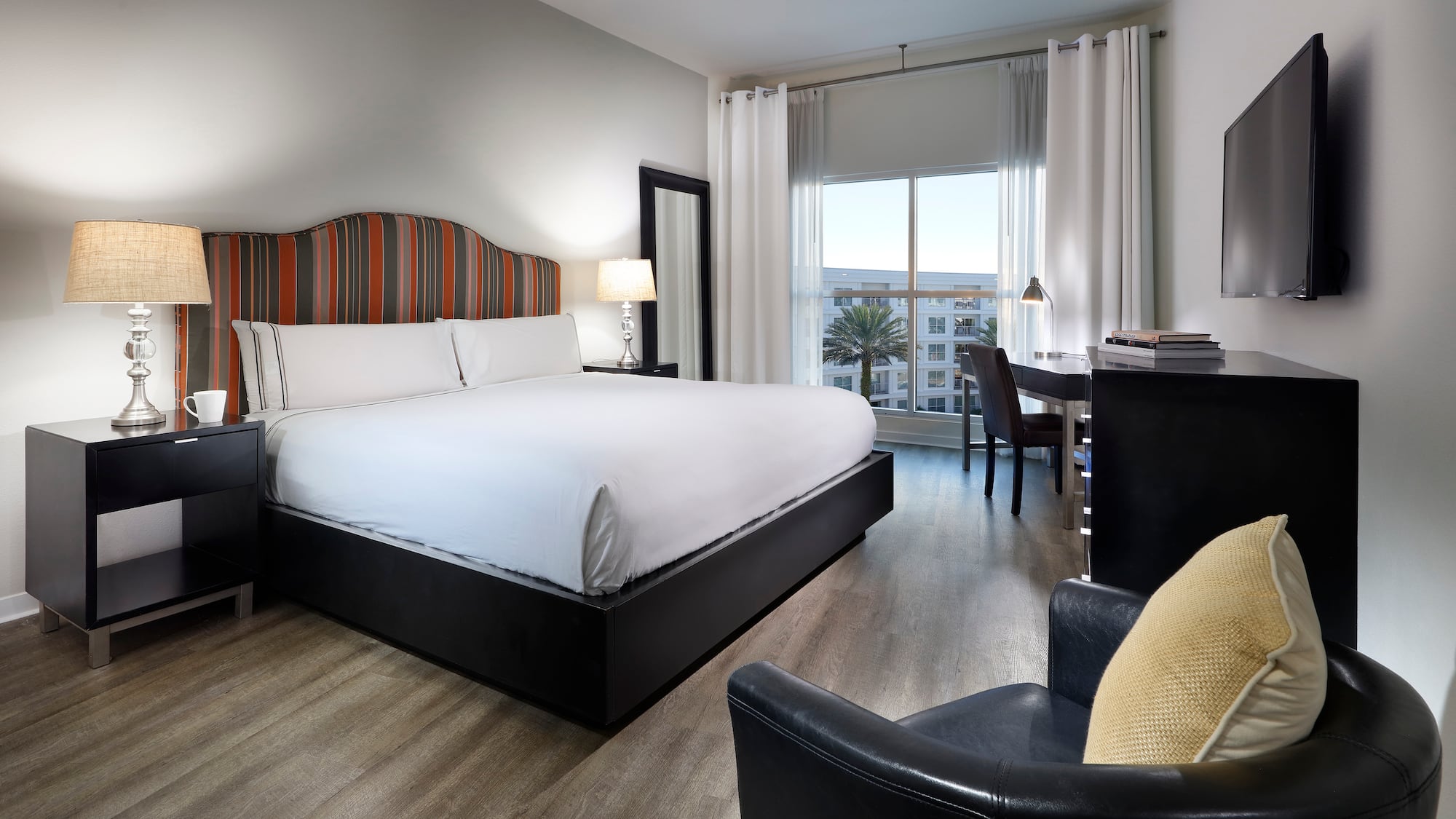 a room with a bed and a desk