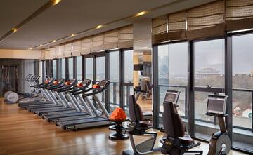 a room with treadmills and exercise equipment
