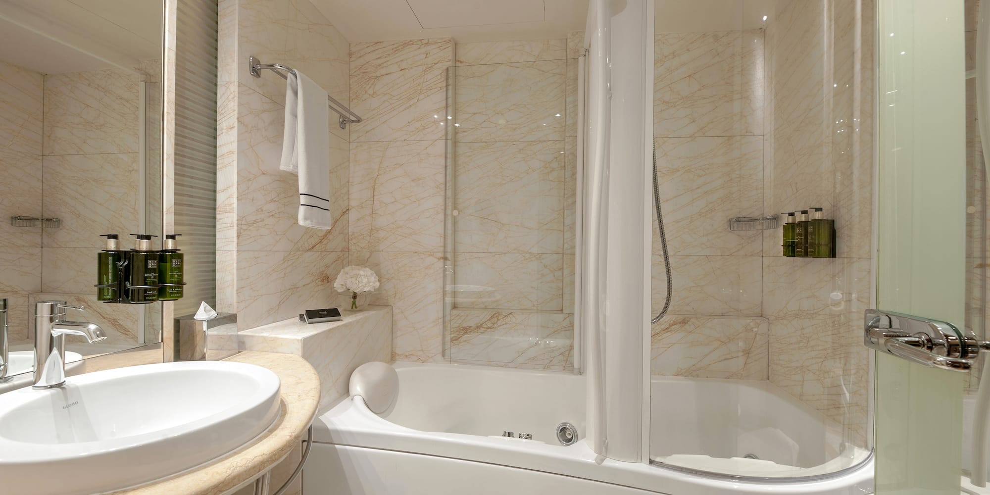 a bathroom with a tub and sink