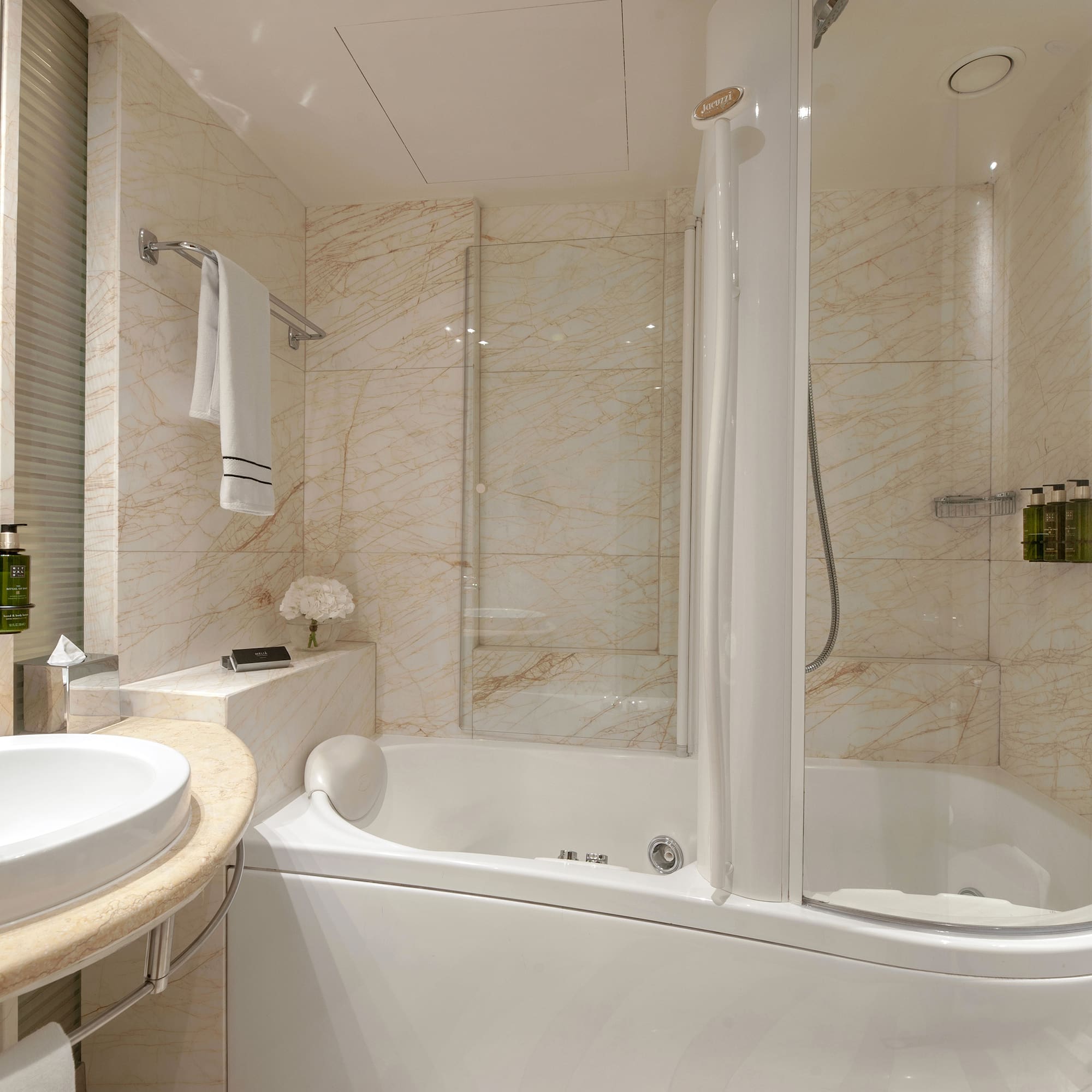 a bathroom with a tub and sink