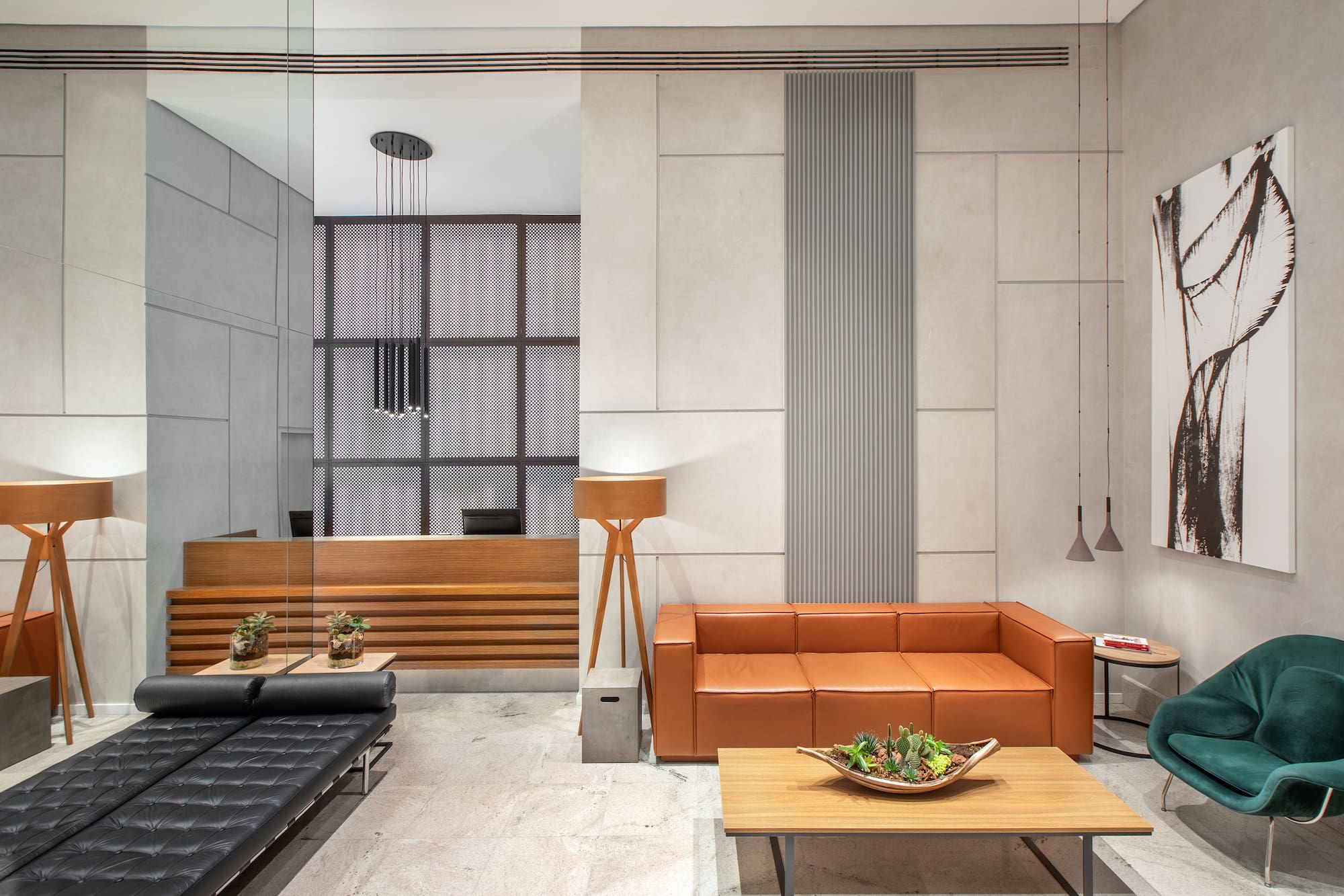 a room with a couch and coffee tables