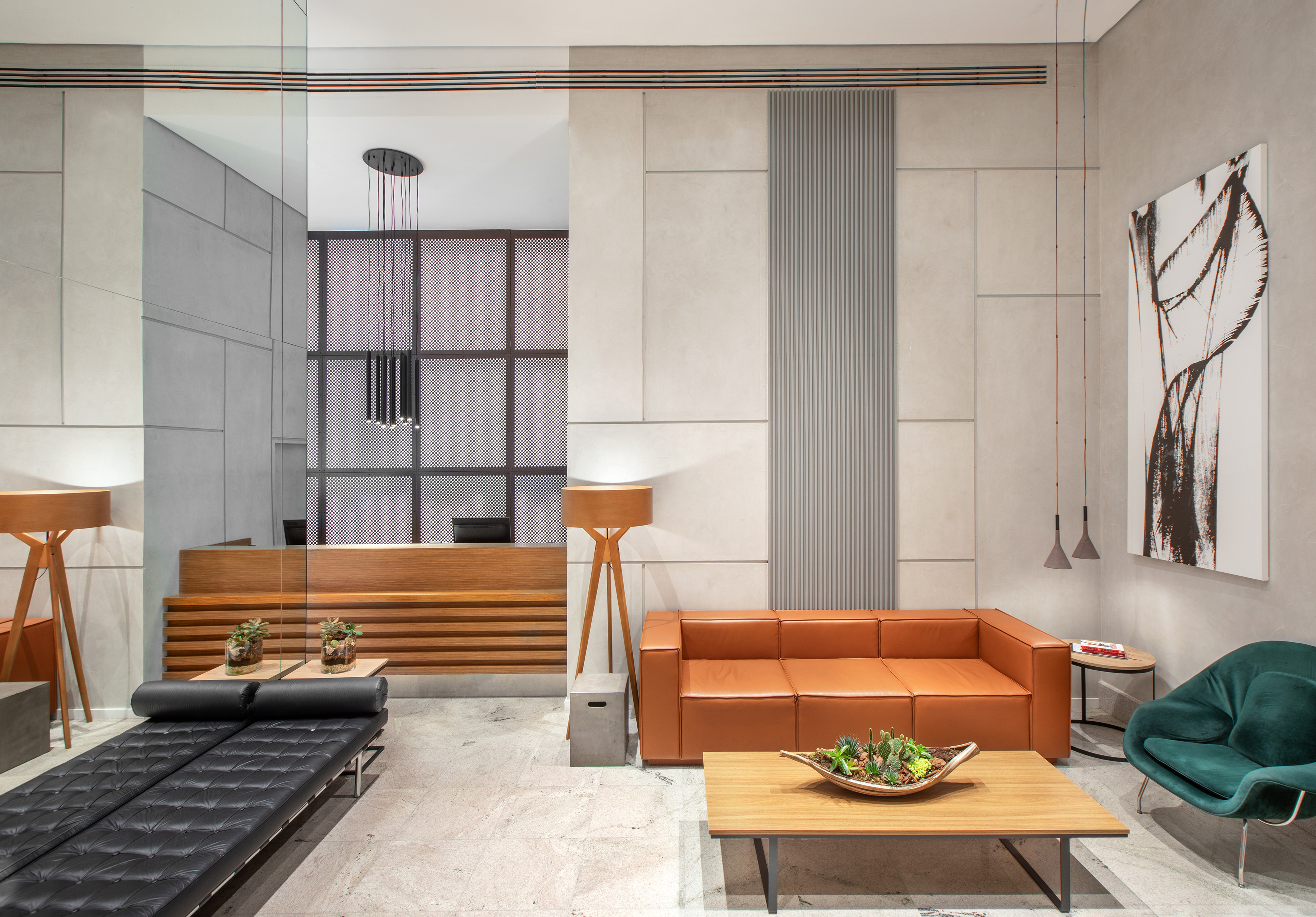 a room with a couch and coffee tables