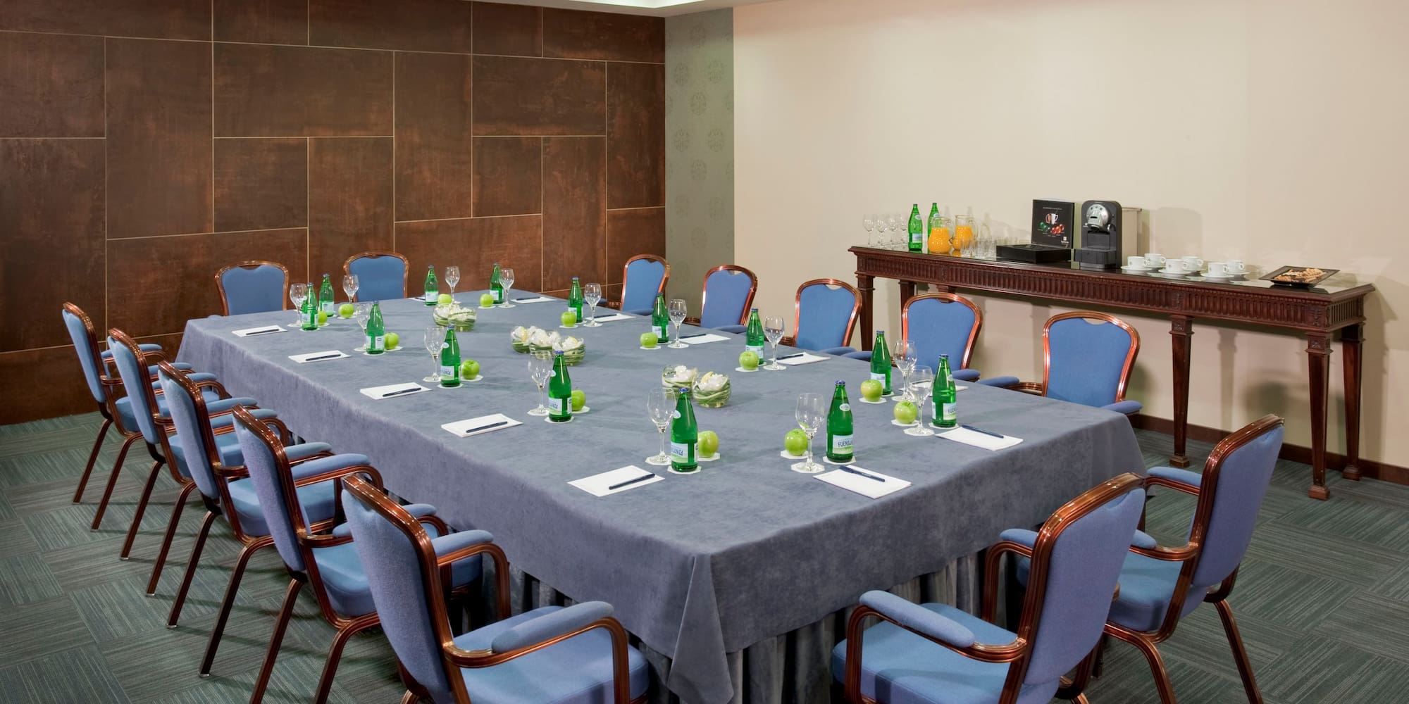 a conference room with a table and chairs
