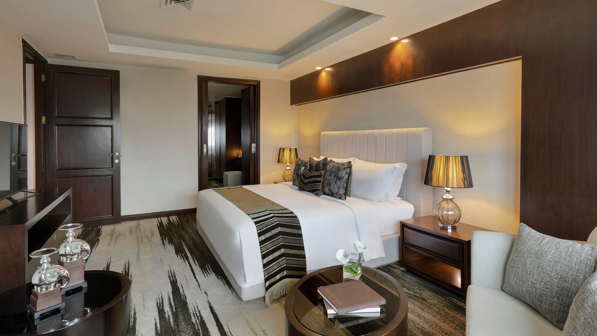 a bedroom with a bed and a table
