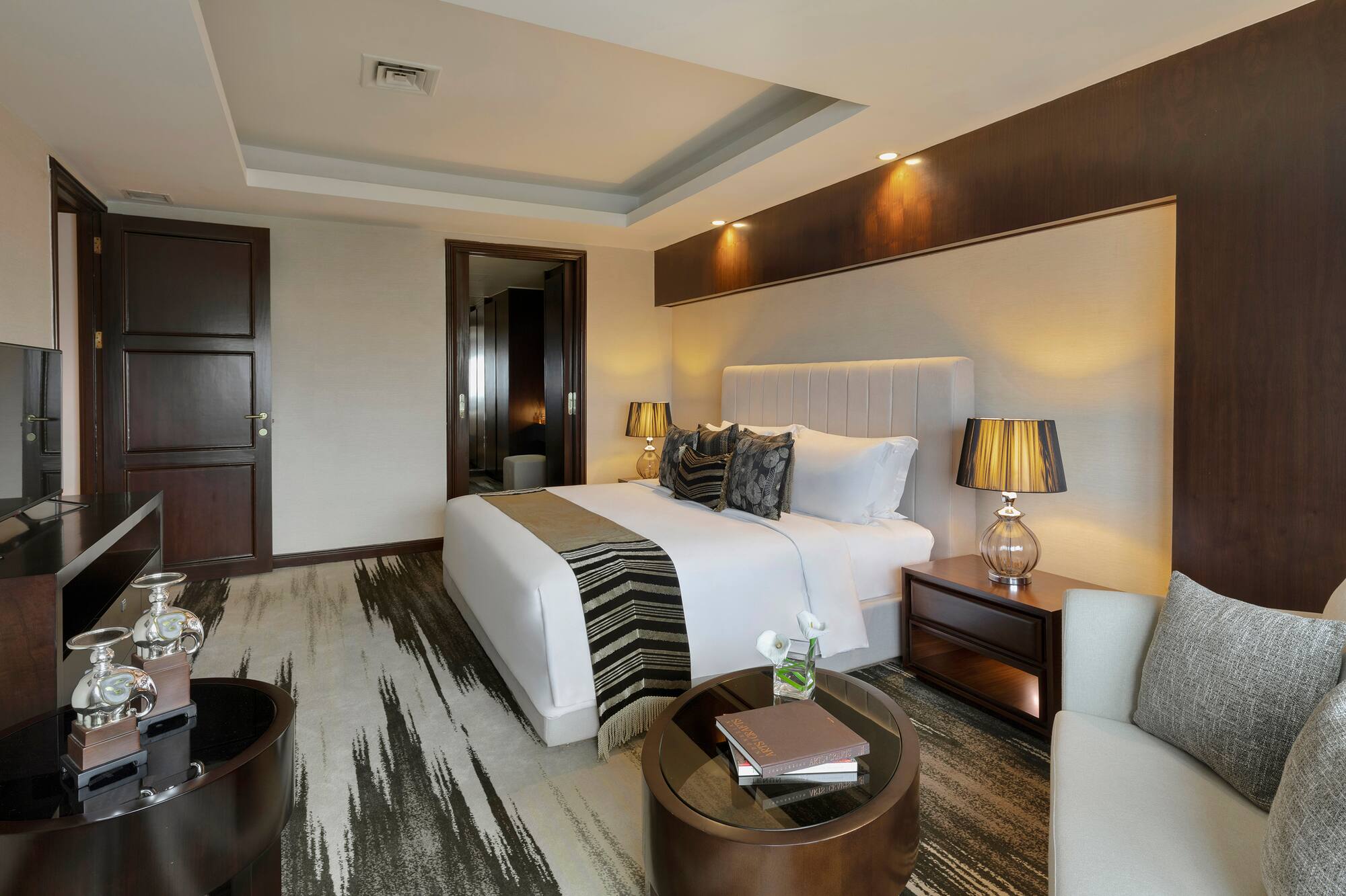 a bedroom with a bed and a table