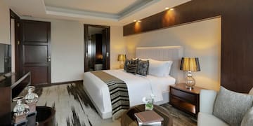 a bedroom with a bed and a table