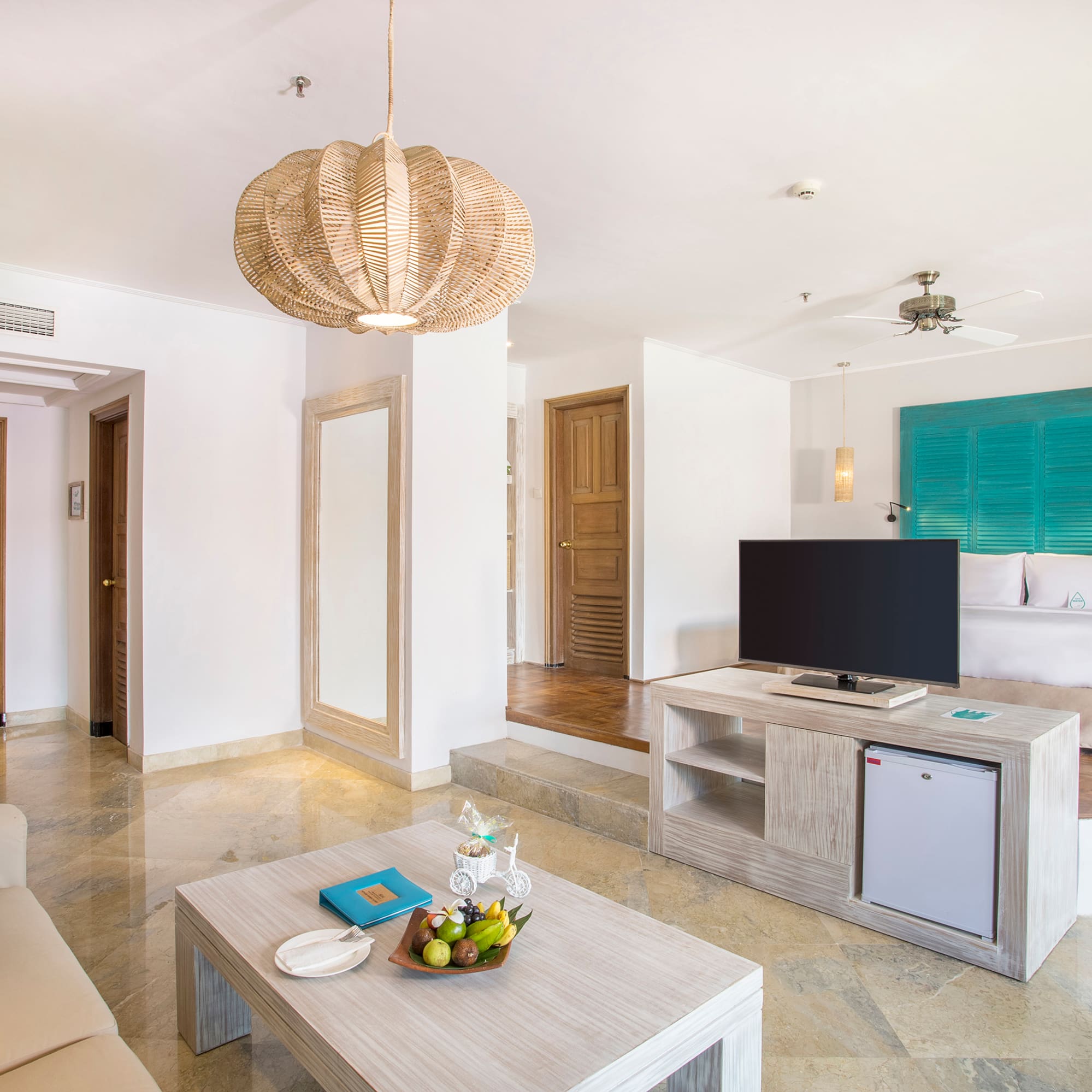 a living room with a television and a couch