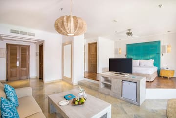 a living room with a television and a couch