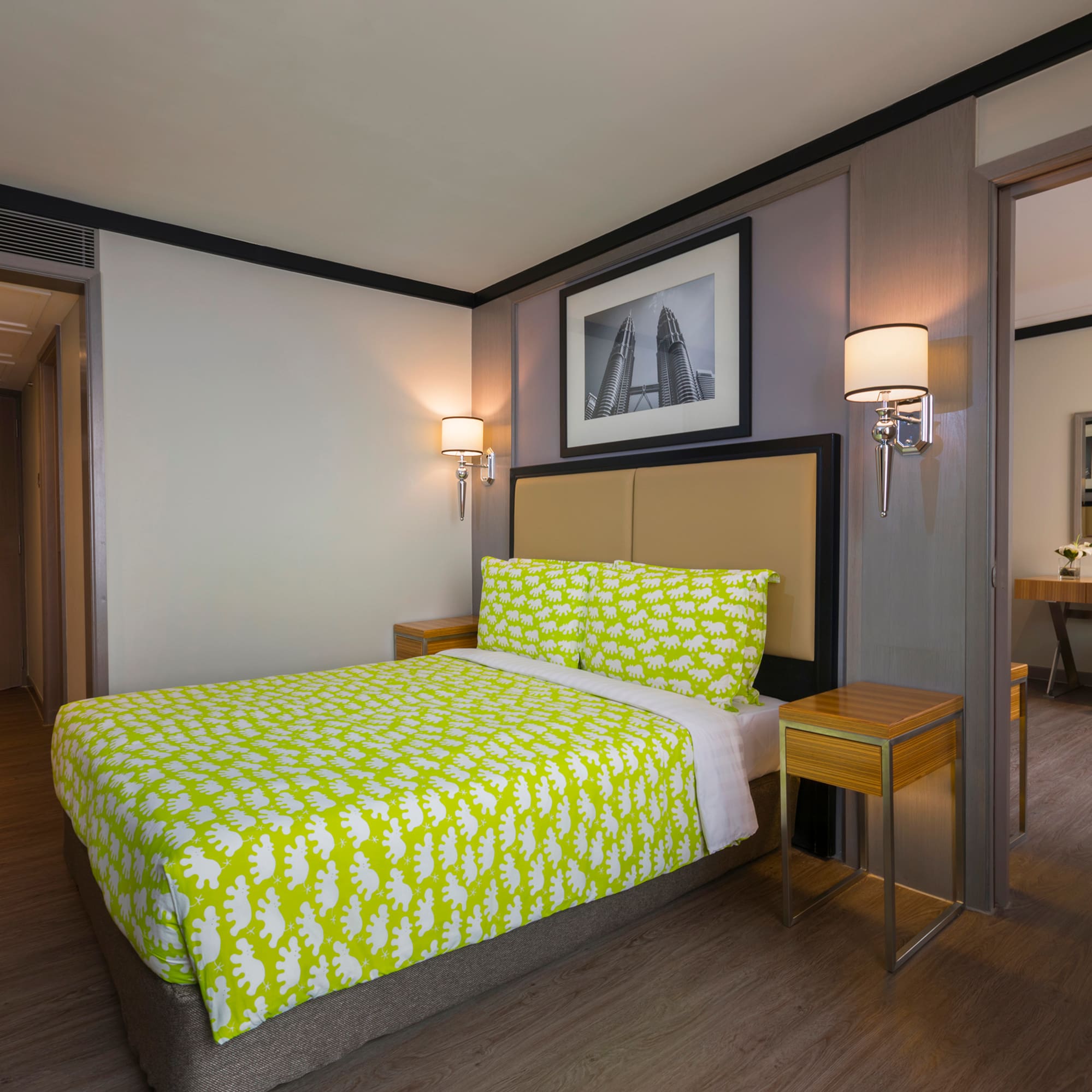 a bed with yellow sheets in a room