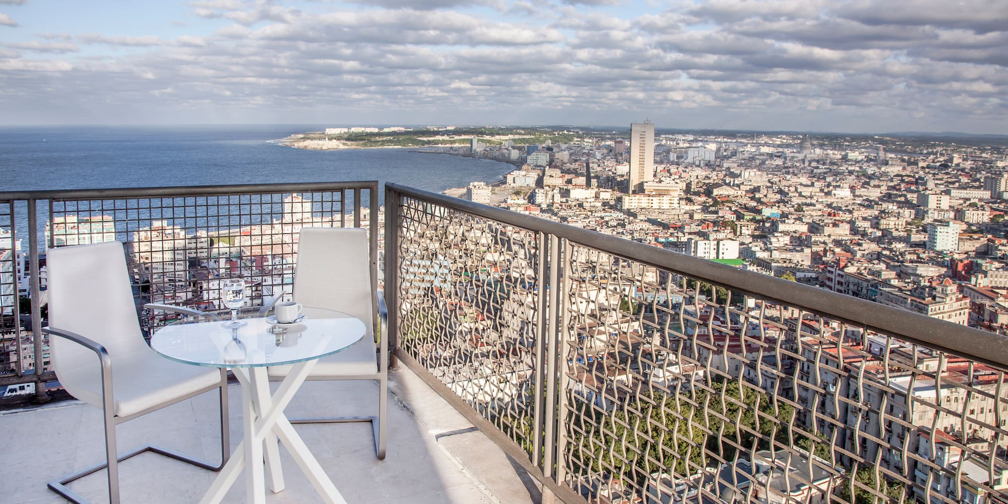 a table and chair overlooking a city