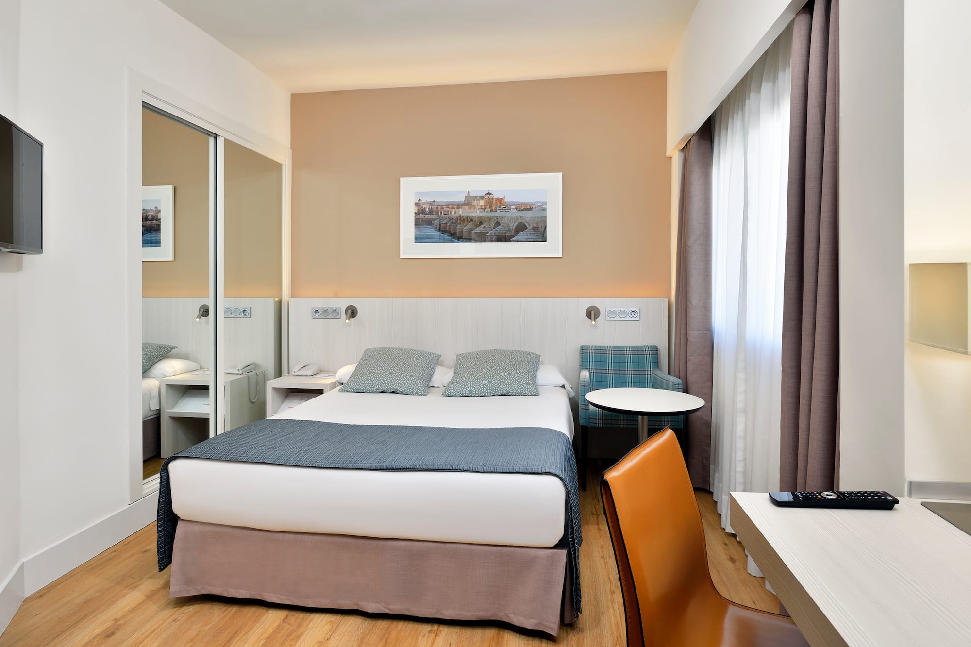 a room with a bed and a chair