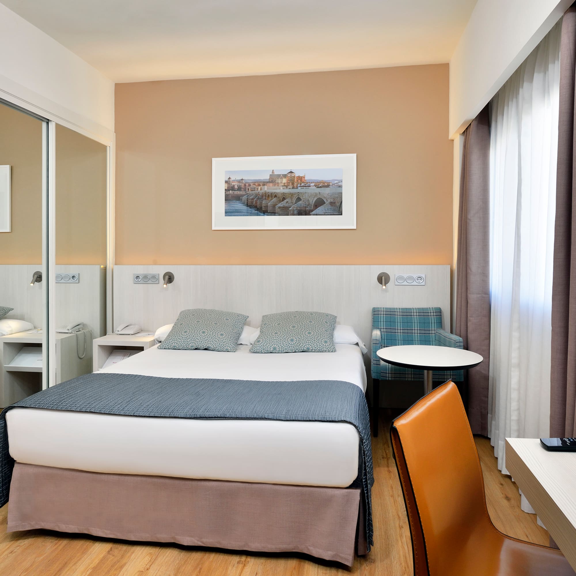 a room with a bed and a chair