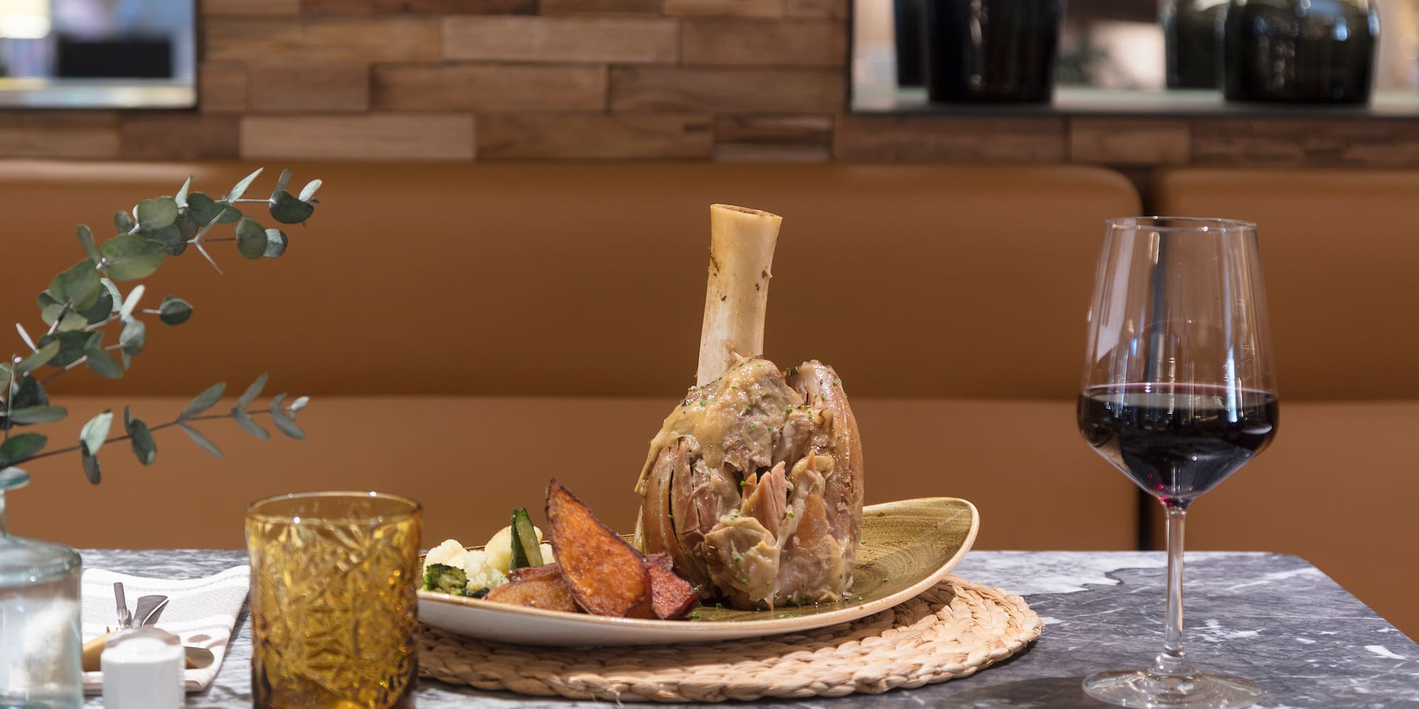 a plate of food and a glass of wine