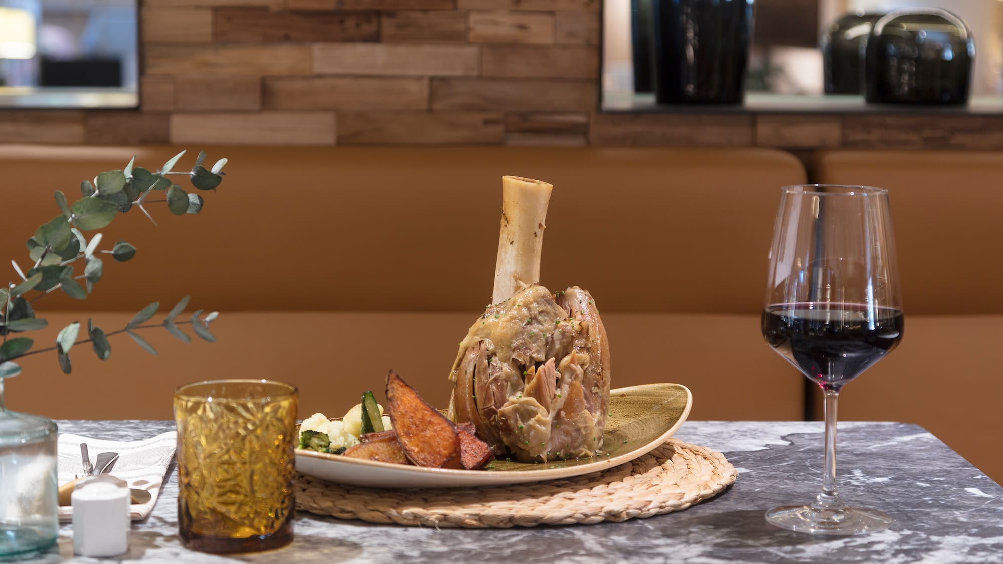 a plate of food and a glass of wine