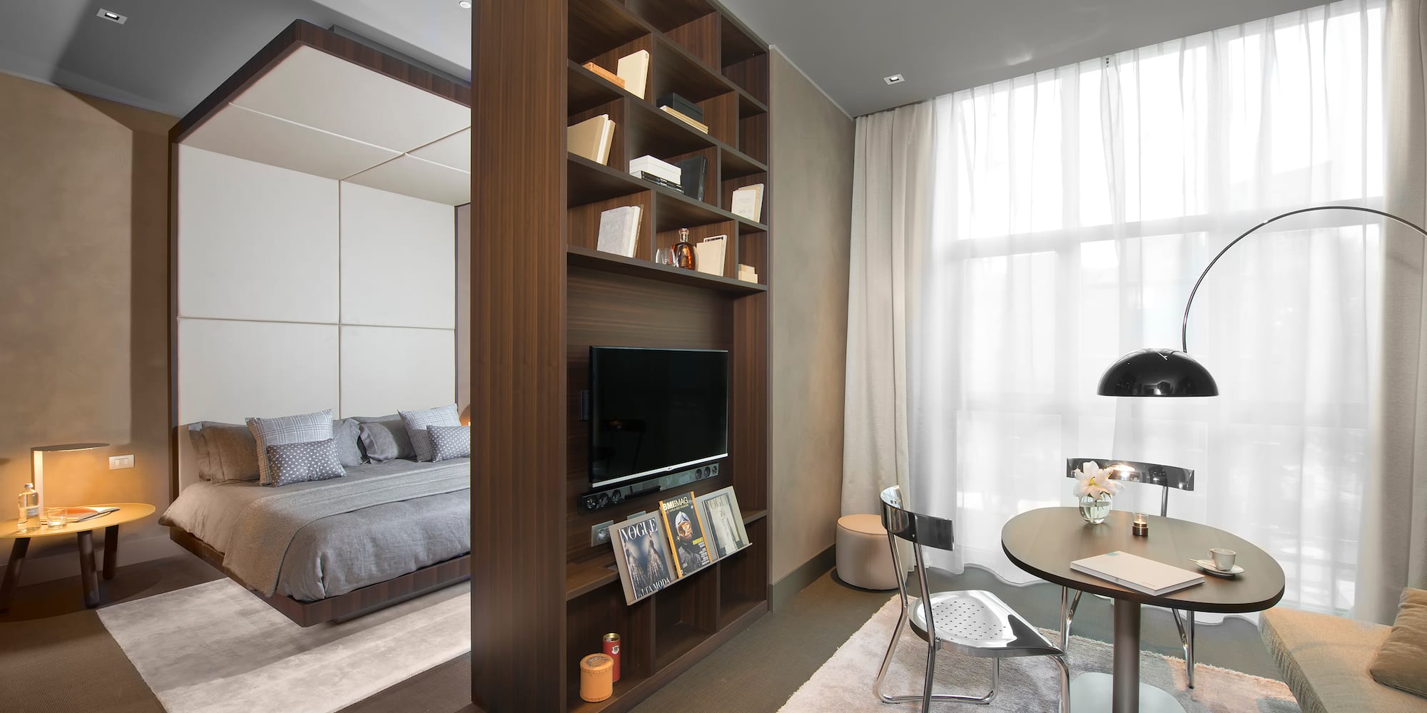 a room with a tv and a bed