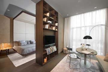 a room with a tv and a bed