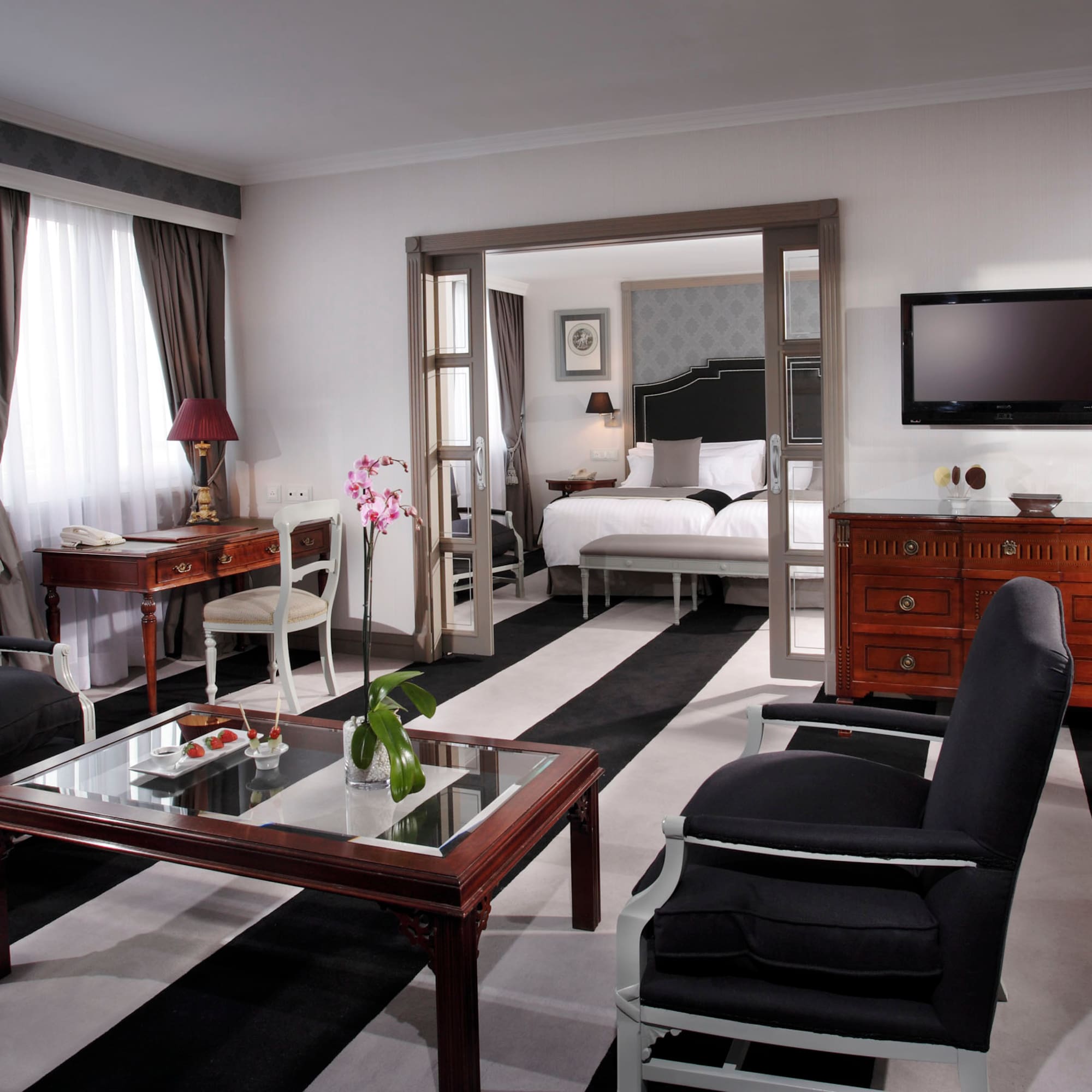 a room with a television and a bed