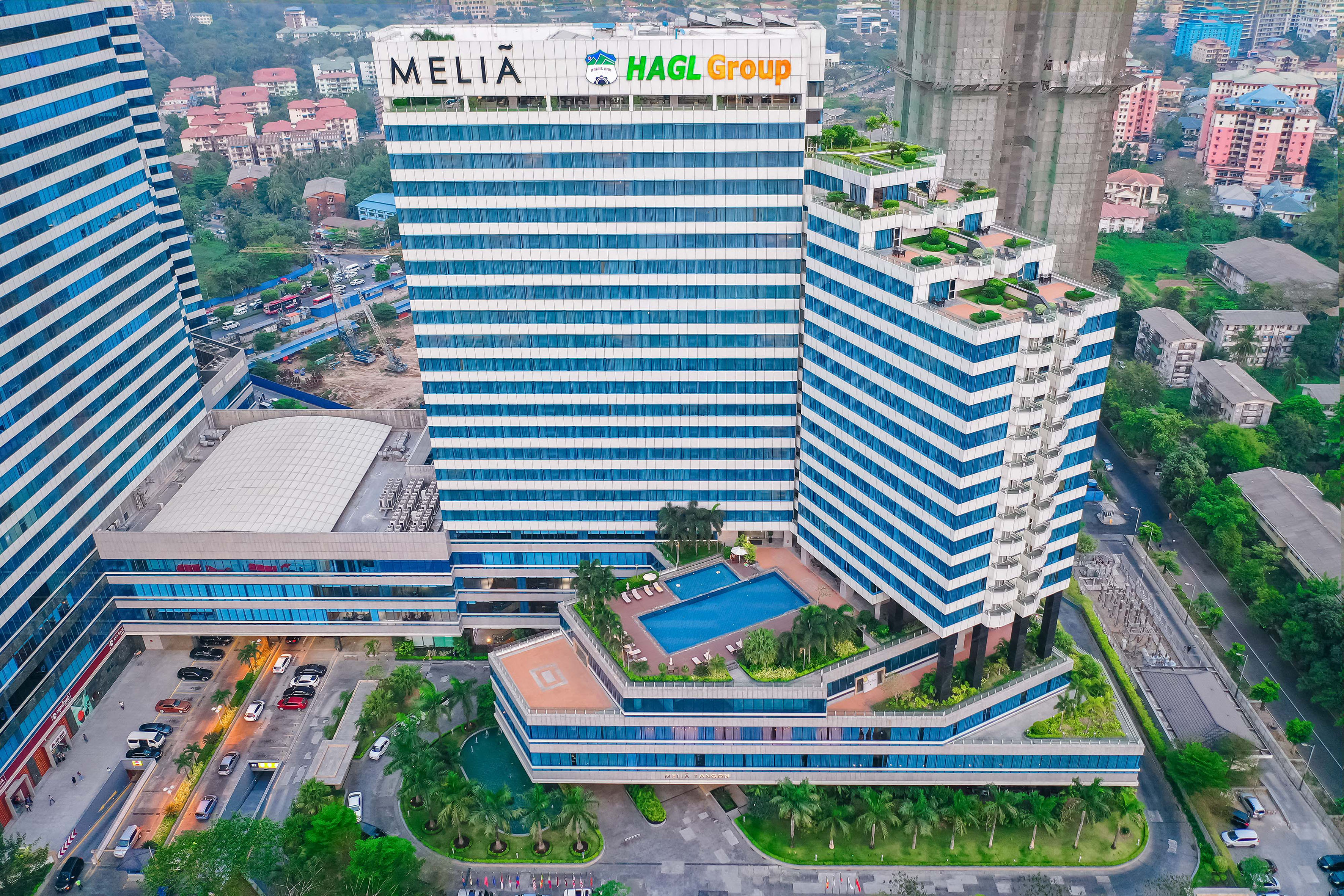 a large building with a pool in the middle of it