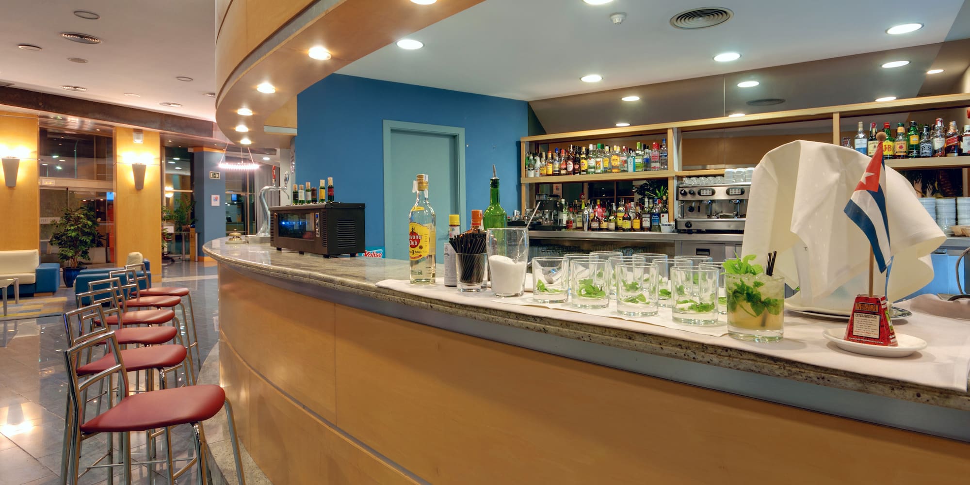 a bar with glasses and drinks on it