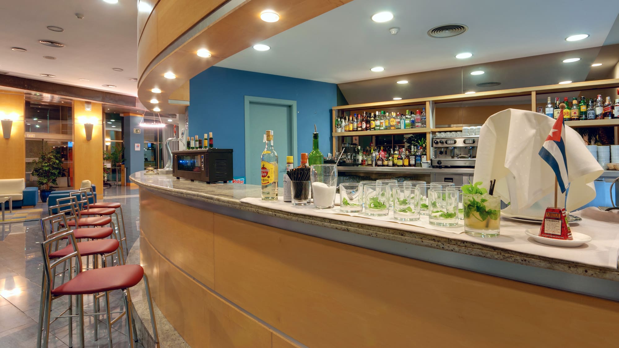 a bar with glasses and drinks on it