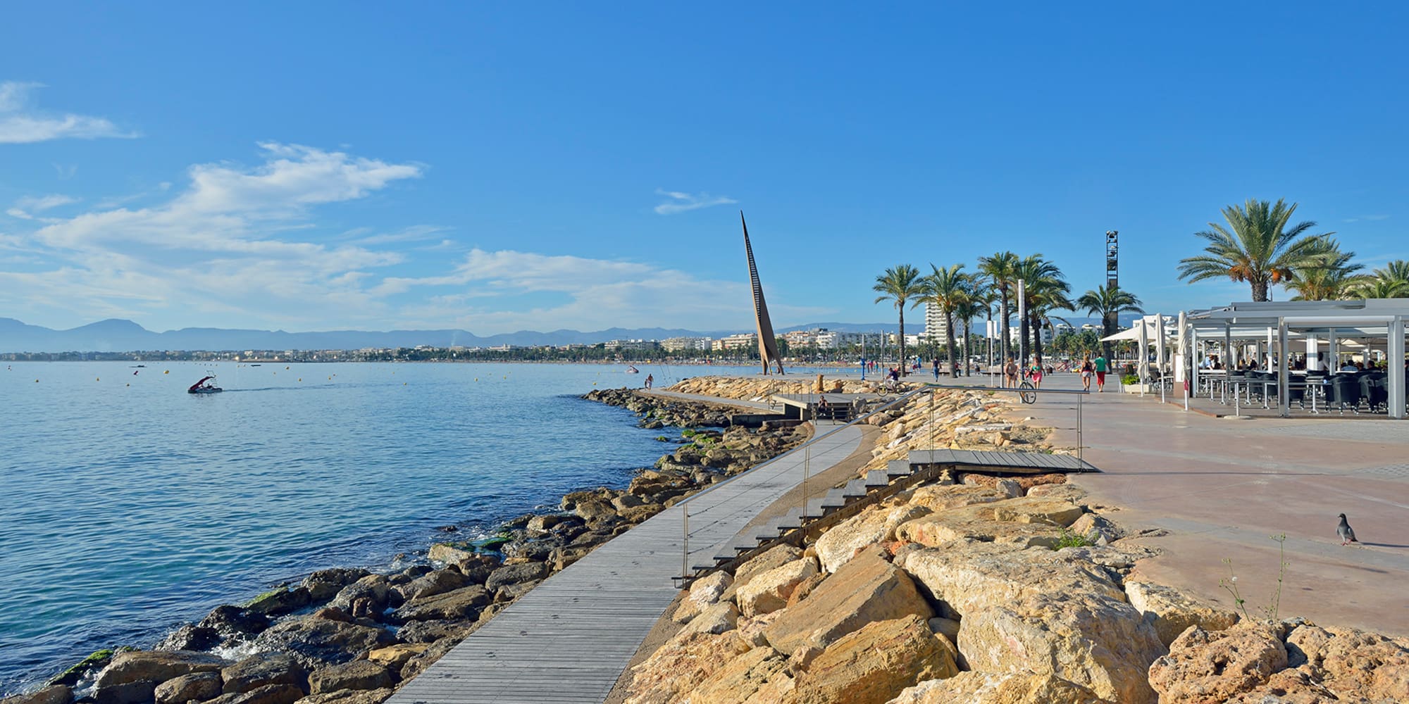a boardwalk along a body of water