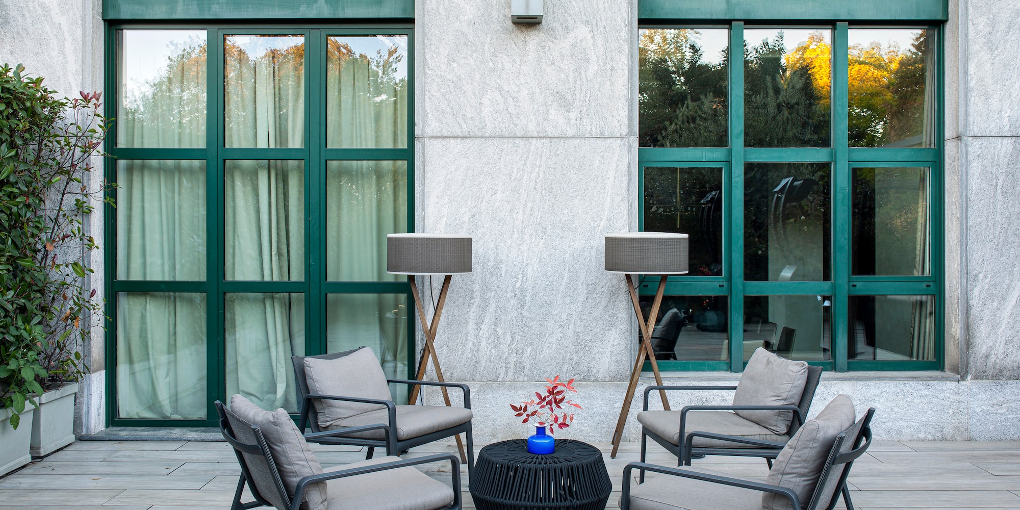 a patio with chairs and a table