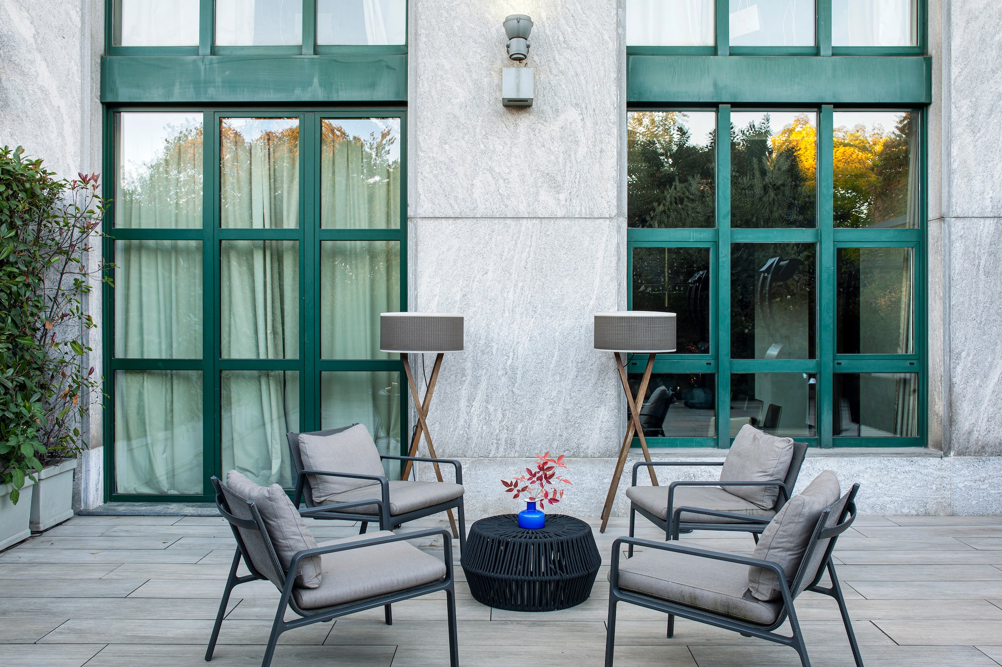 a patio with chairs and a table