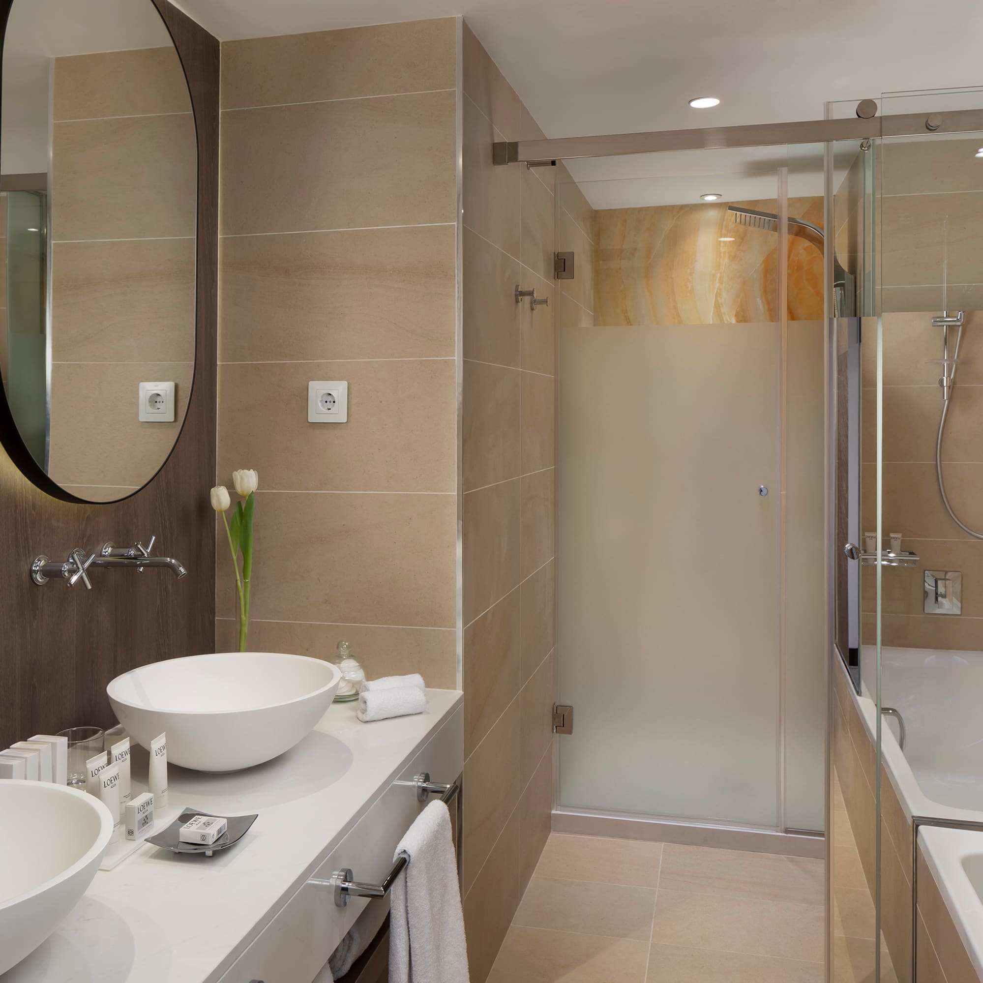 a bathroom with a shower and sink