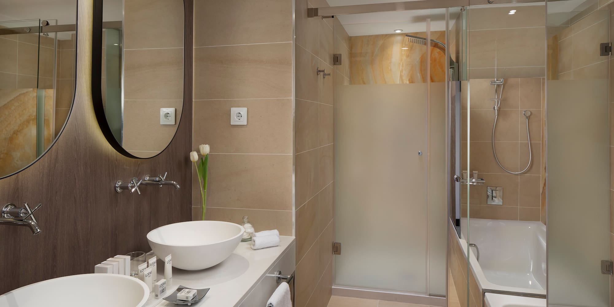 a bathroom with a shower and sink