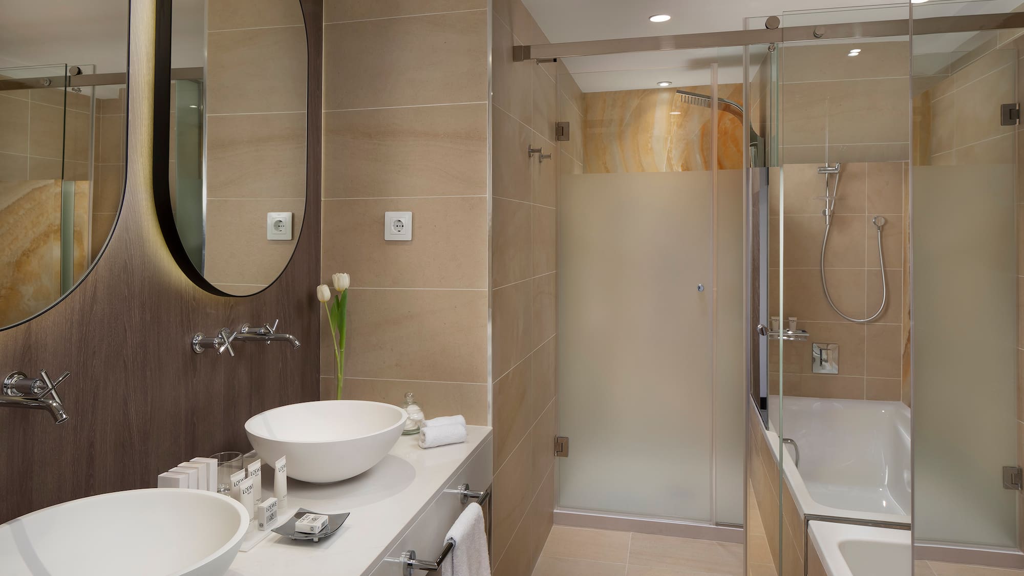 a bathroom with a shower and sink