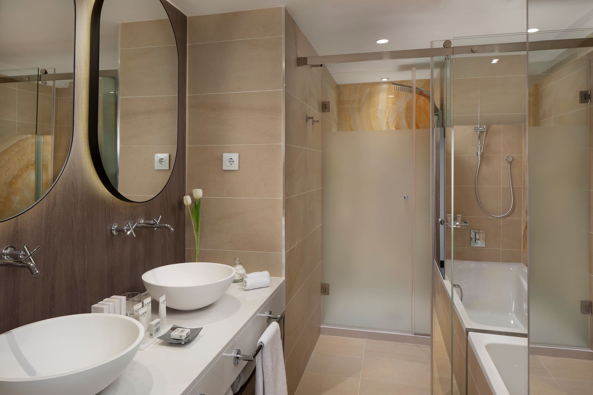 a bathroom with a shower and sink