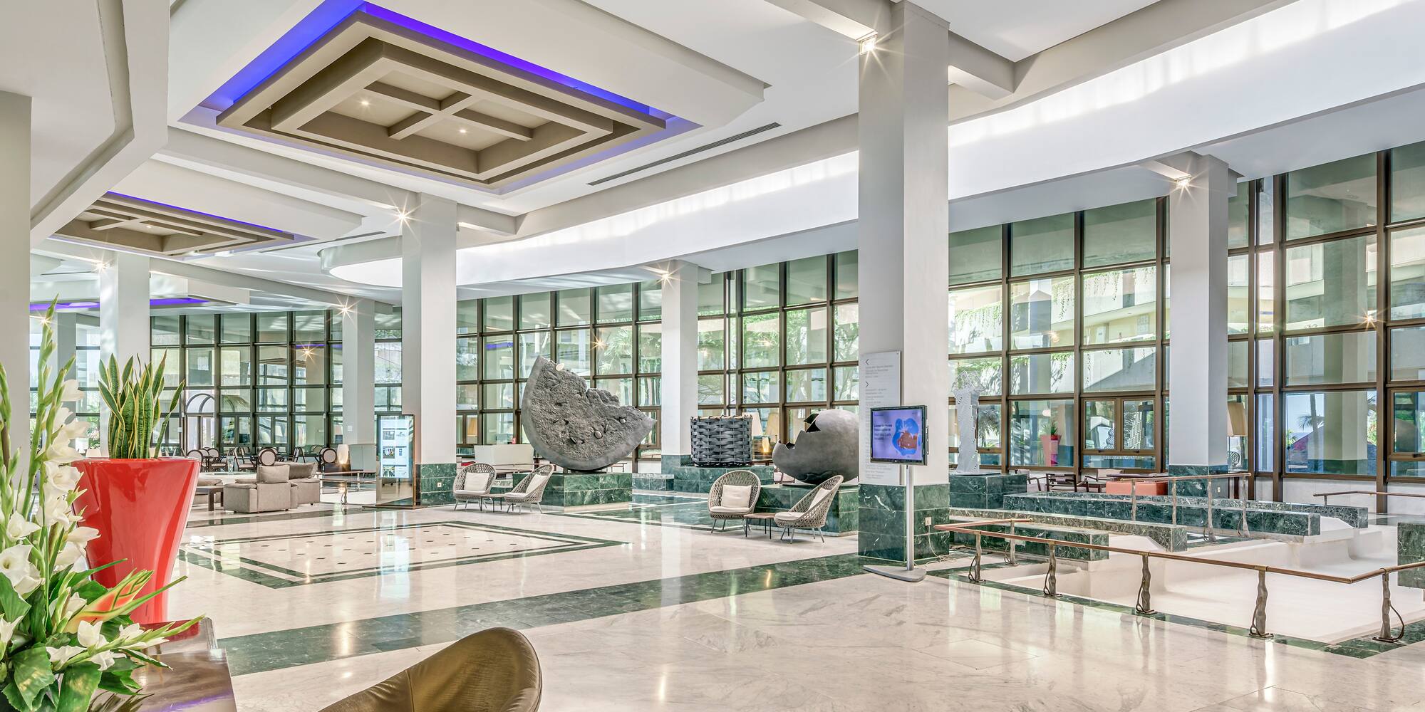 a large lobby with a large stone sculpture