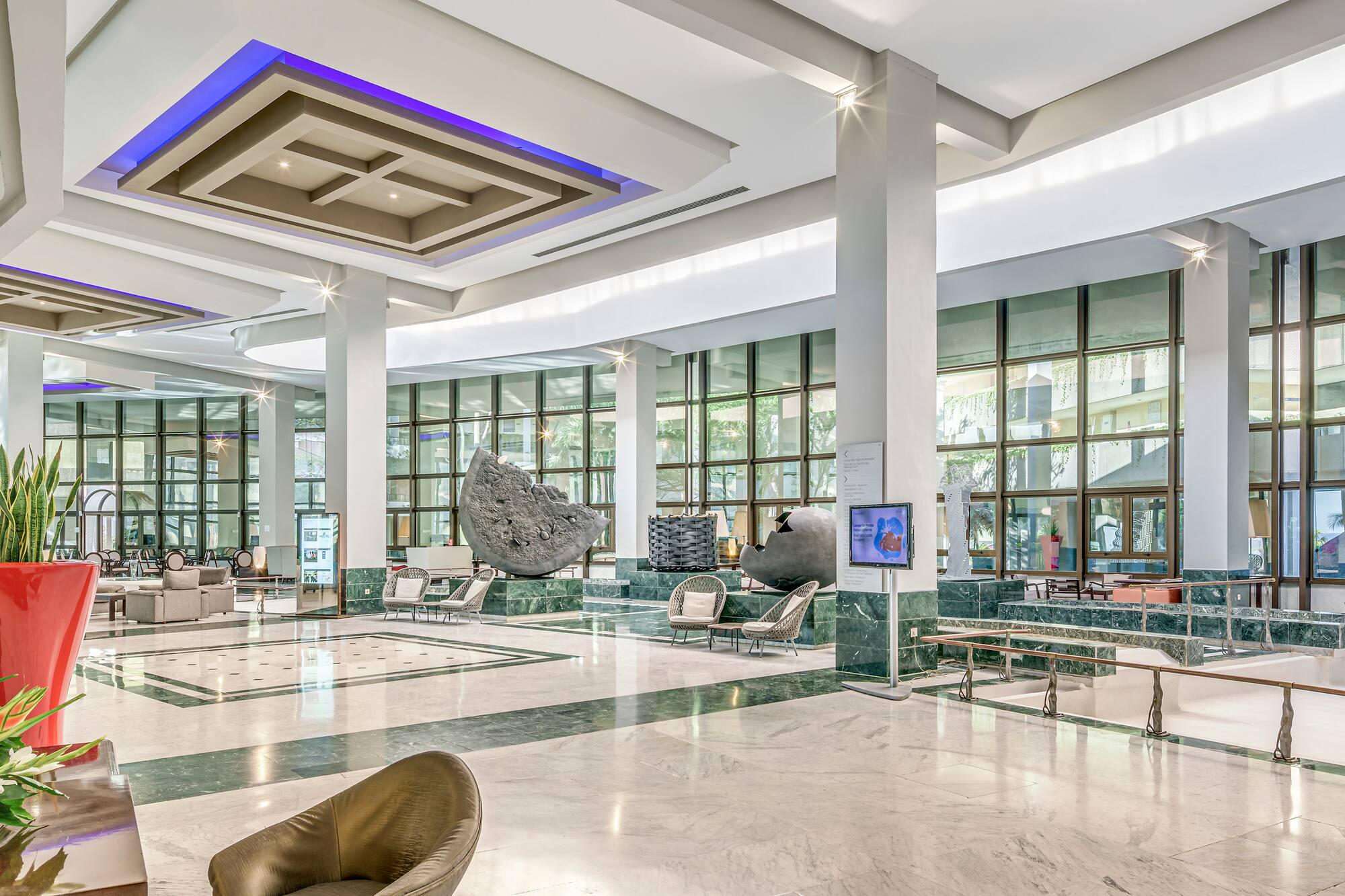 a large lobby with a large stone sculpture