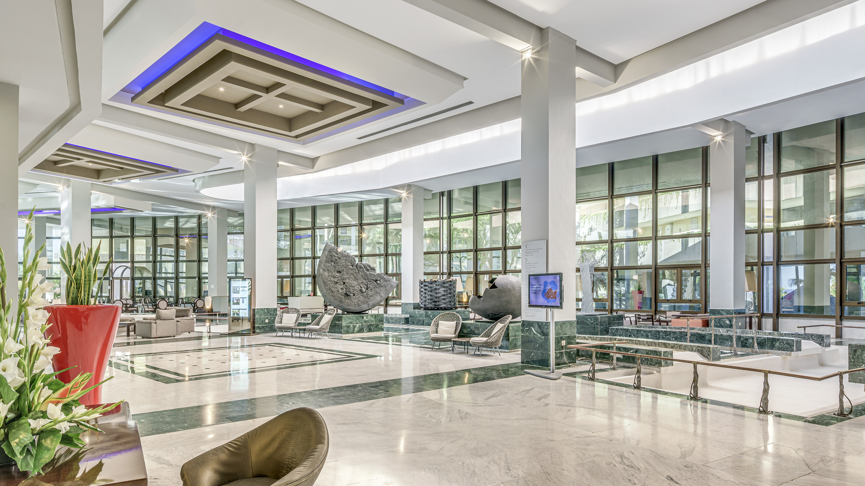 a large lobby with a large stone sculpture