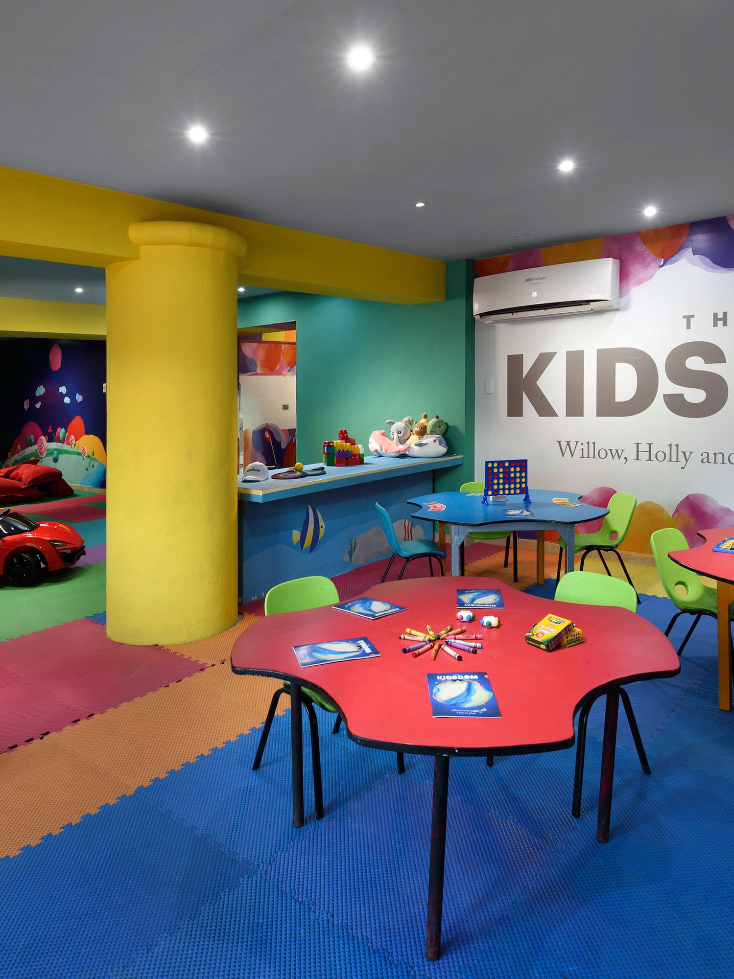 a room with colorful tables and toys