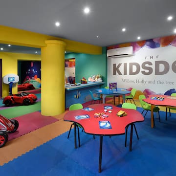 a room with colorful tables and toys