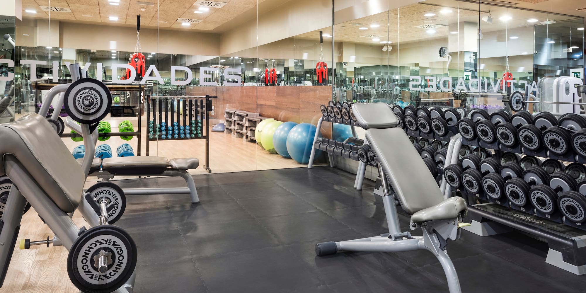 a gym with weights and exercise equipment