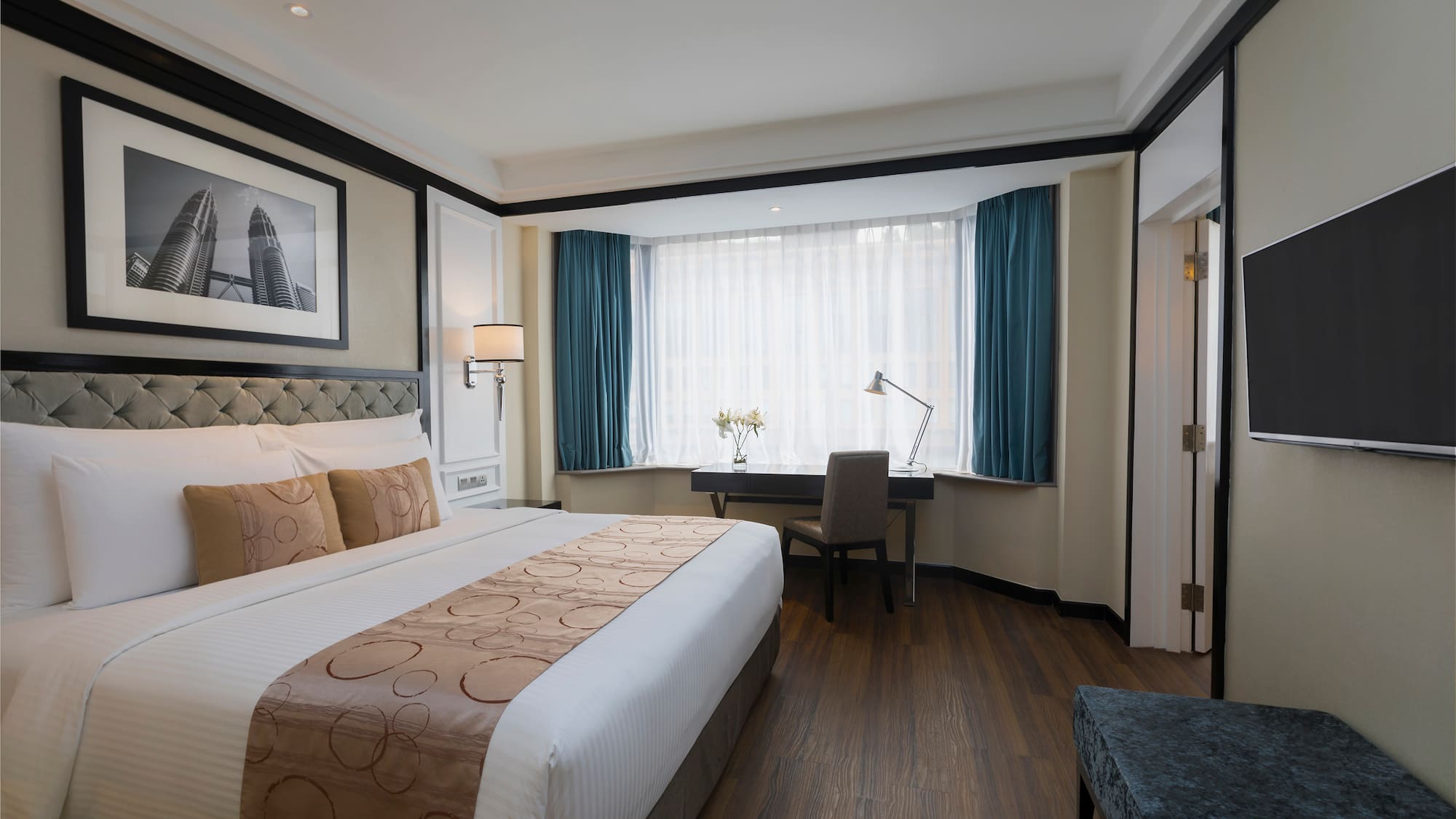 a bedroom with a bed and a desk