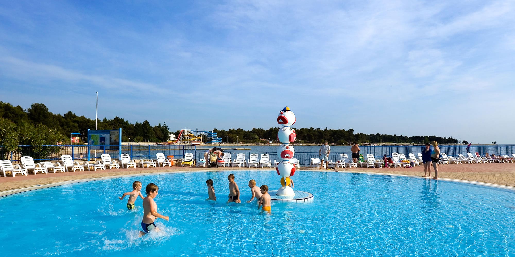 a group of kids in a pool