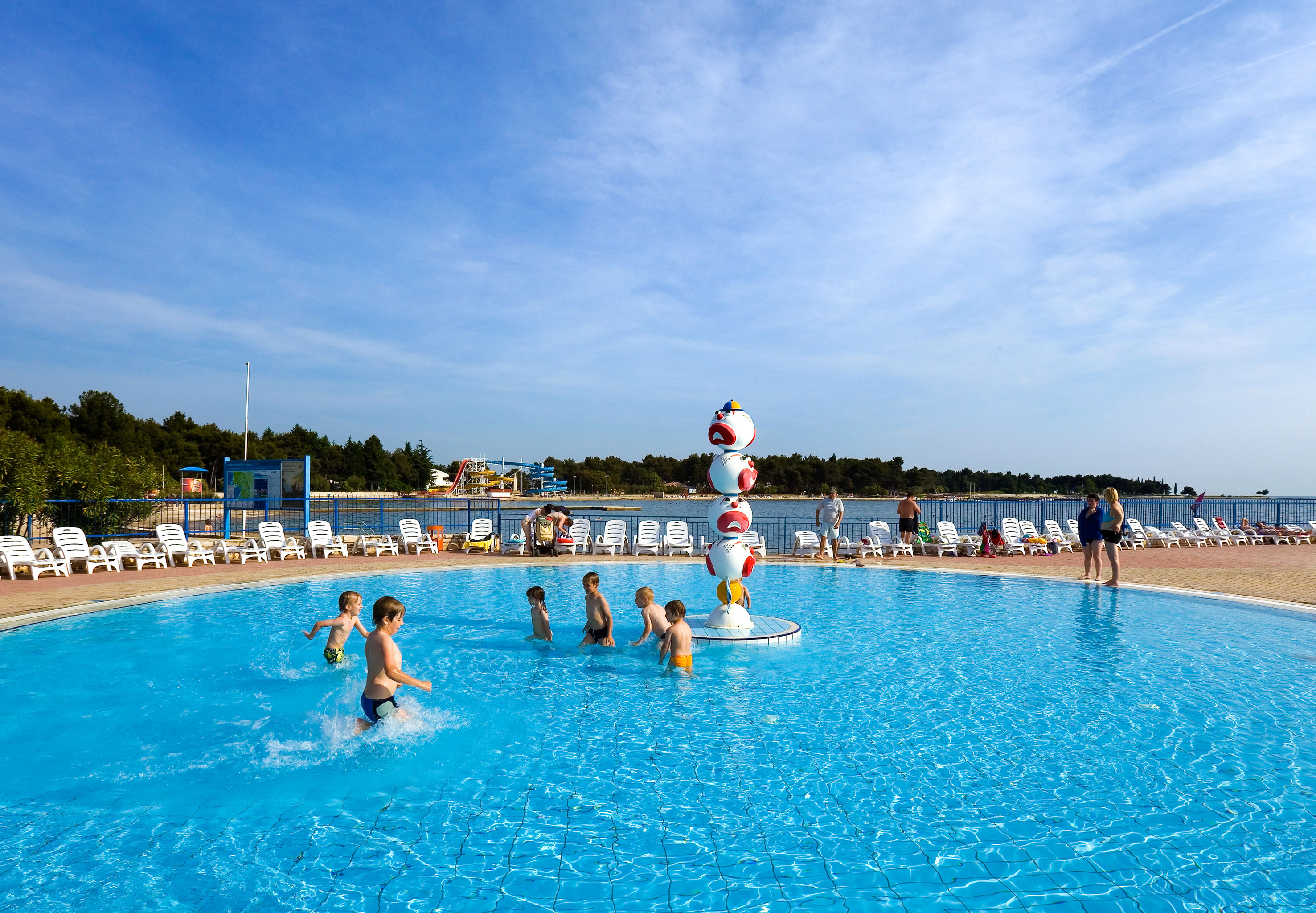 a group of kids in a pool