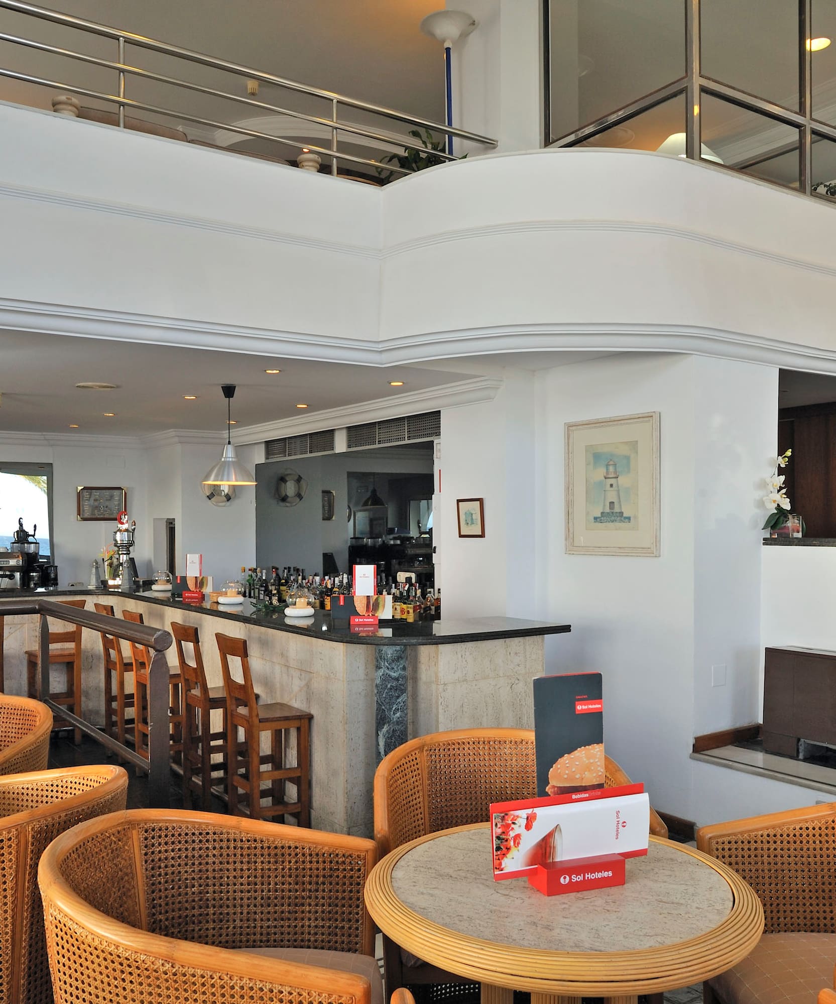 a room with a bar and chairs