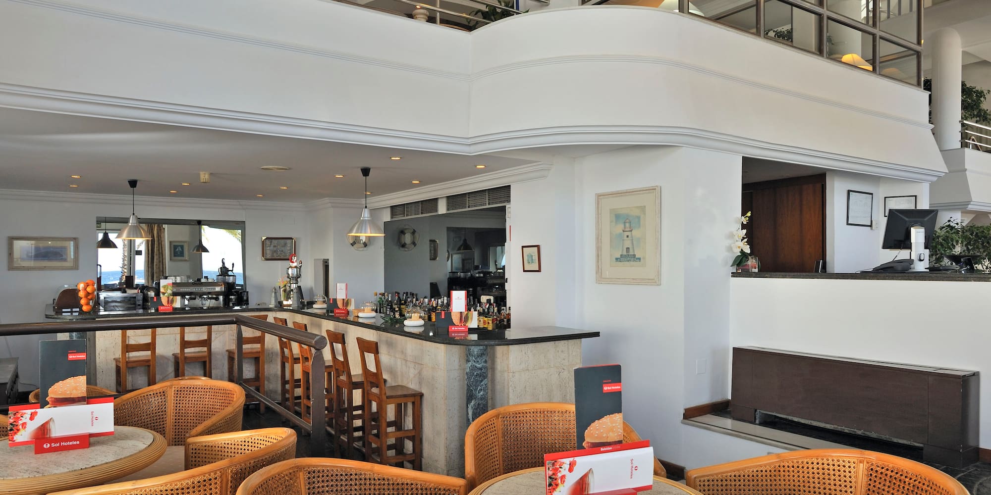 a room with a bar and chairs